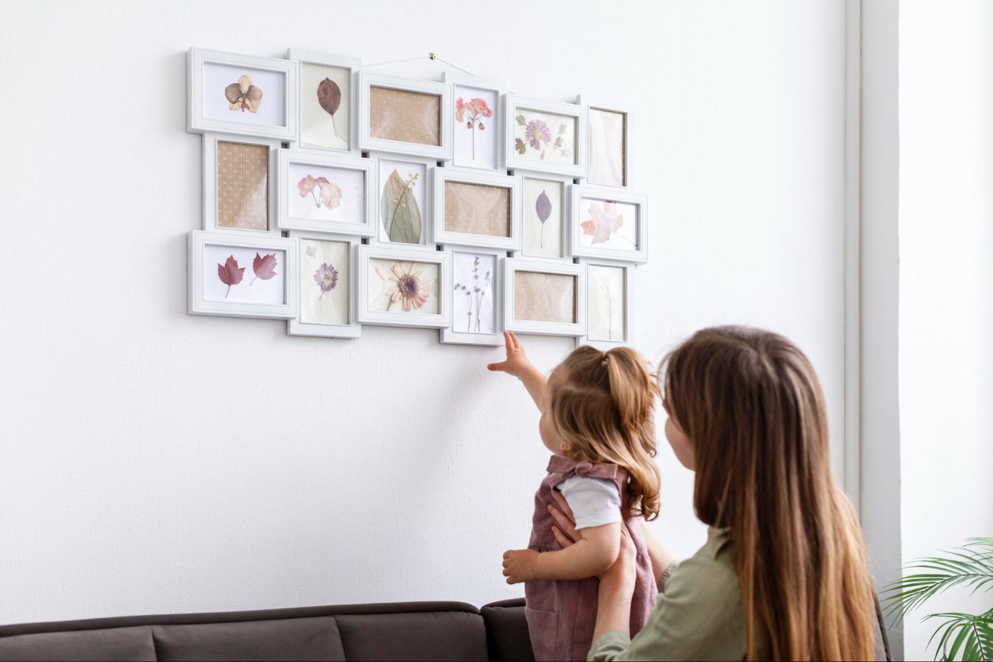 Mother and daughter admiring botanical photo frame gallery in Sharjah