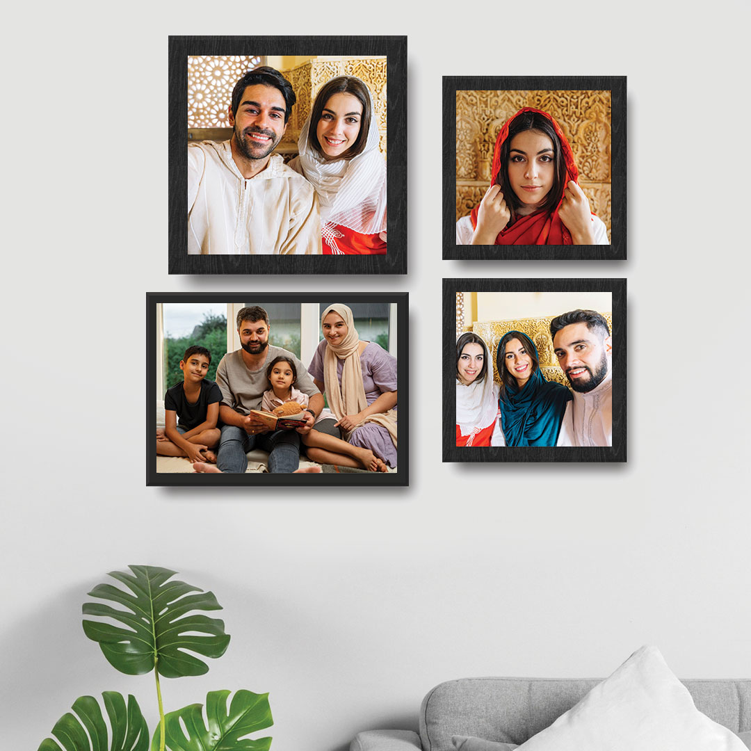 Artistic wall decor with framed art prints and colorful cushions in UAE.